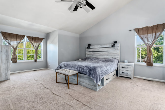 2602 Lundquist Drive Aurora, IL 60503 - Photo 13 of 30 a bedroom with a bed and a large window