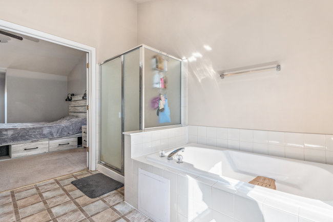 2602 Lundquist Drive Aurora, IL 60503 - Photo 20 of 30 a bathroom with a bathtub and a shower
