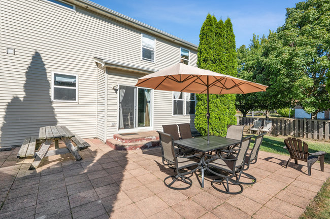 2602 Lundquist Drive Aurora, IL 60503 - Photo 24 of 30 a view of a chair and tables in the patio