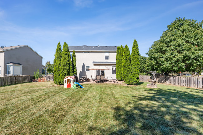2602 Lundquist Drive Aurora, IL 60503 - Photo 25 of 30 a view of a house with backyard and a tree