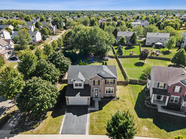 2602 Lundquist Drive Aurora, IL 60503 - Photo 3 of 30 an aerial view of a house with a swimming pool