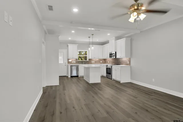 a view of kitchen with wooden floor