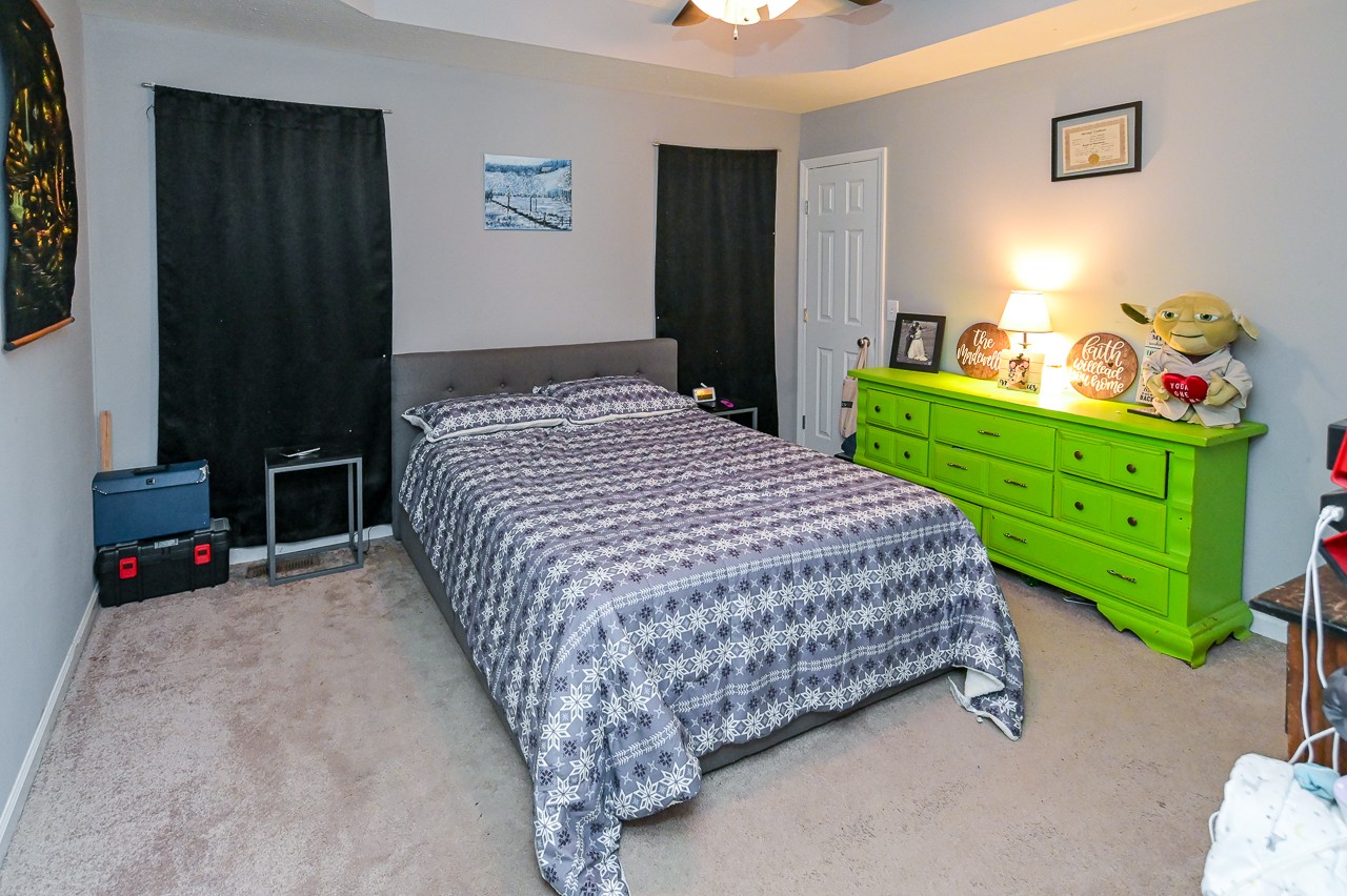 280 Flintville School Road Elora, TN 37328 - Photo 18 of 40 a bedroom with a bed a dresser and a window