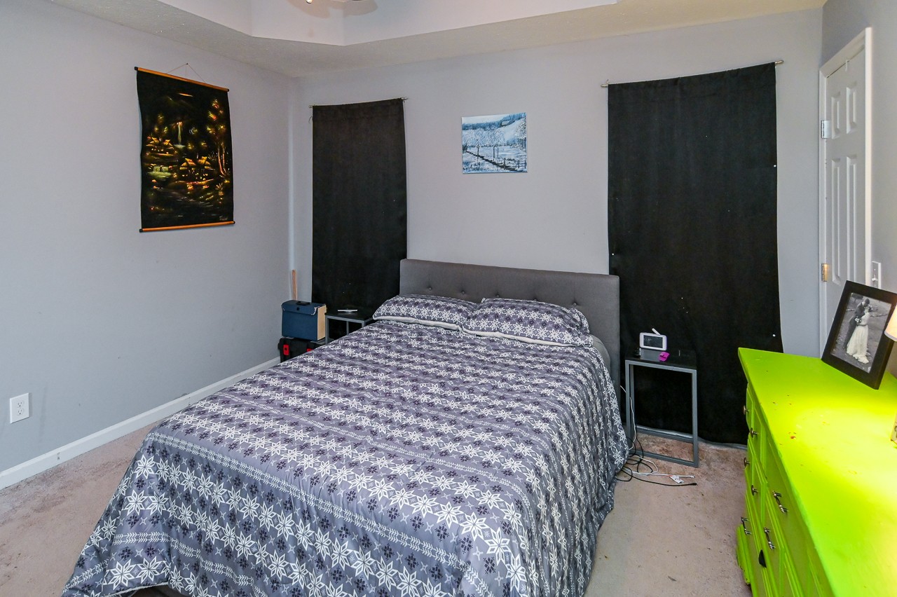 280 Flintville School Road Elora, TN 37328 - Photo 19 of 40 a bedroom with a bed and a wall painting