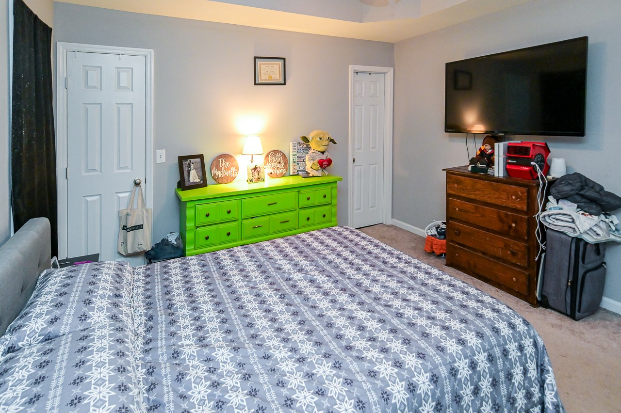 280 Flintville School Road Elora, TN 37328 - Photo 21 of 40 a bedroom with a bed and a flat screen tv