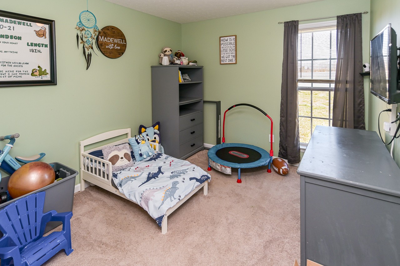 280 Flintville School Road Elora, TN 37328 - Photo 23 of 40 a bedroom with bed and a large window