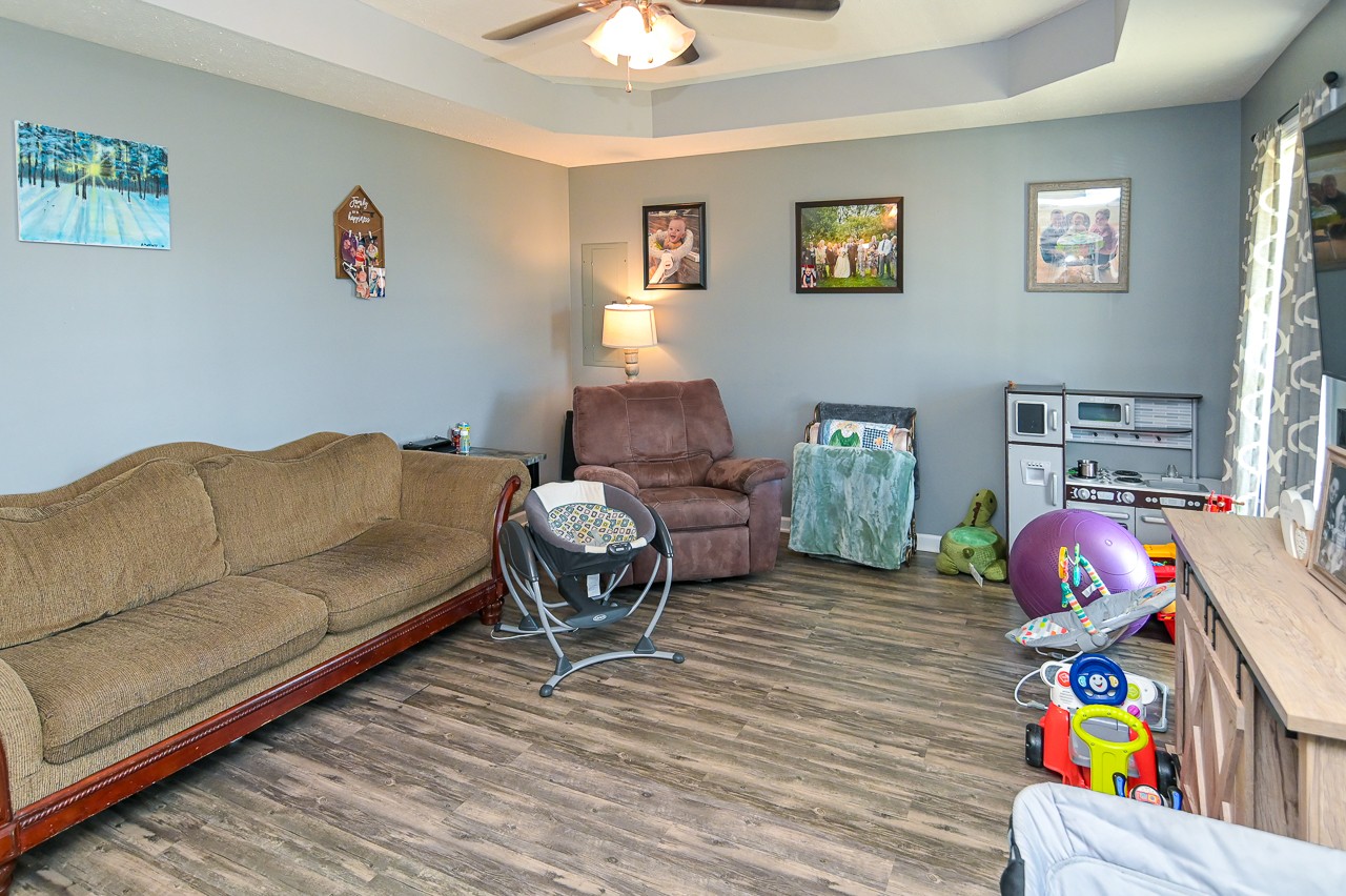 280 Flintville School Road Elora, TN 37328 - Photo 8 of 40 a living room with furniture a baby crib and a couch