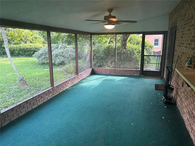 a view of empty room with floor to ceiling window