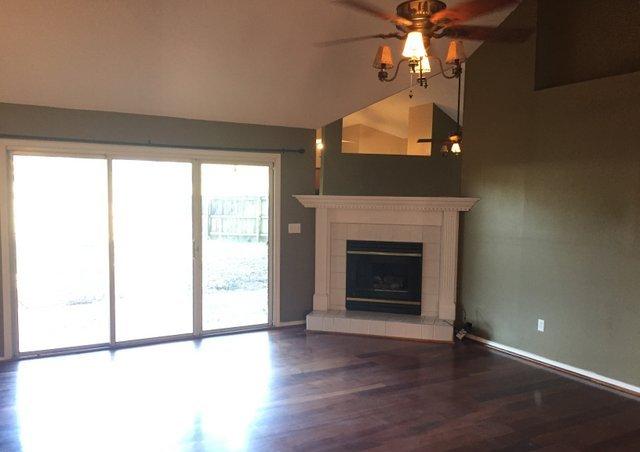 4587 Top Flight Drive Crestview, FL 32539 - Photo 2 of 16 a view of a livingroom with a fireplace and a window