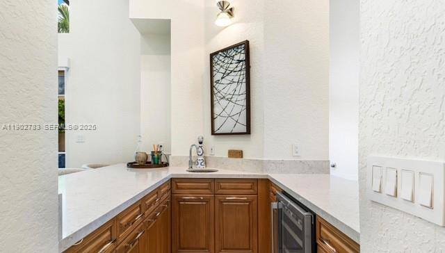 2393 Northwest 49th Lane Boca Raton, FL 33431 - Photo 13 of 21 a kitchen with a sink and a refrigerator