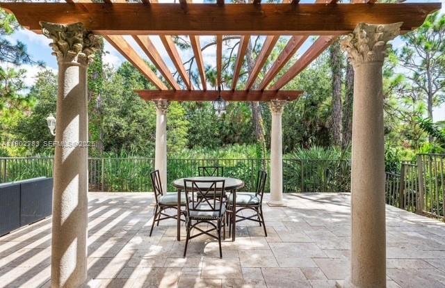 2393 Northwest 49th Lane Boca Raton, FL 33431 - Photo 15 of 21 a patio with yard glass top table and chairs