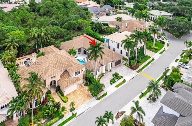 2393 Northwest 49th Lane Boca Raton, FL 33431 - Photo 20 of 21 an aerial view of a house with swimming pool and garden