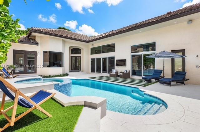 2393 Northwest 49th Lane Boca Raton, FL 33431 - Photo 7 of 21 a view of a house with swimming pool and sitting area