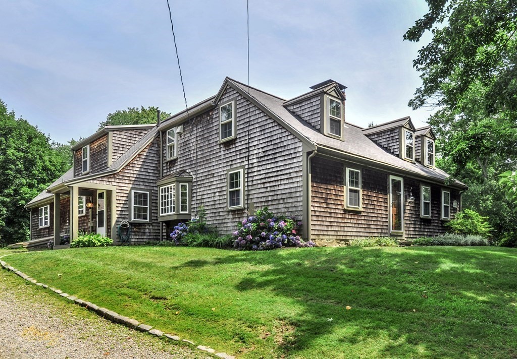 208 Prospect Street Hingham, MA 02043 - Photo 1 of 34 a front view of a house with a garden