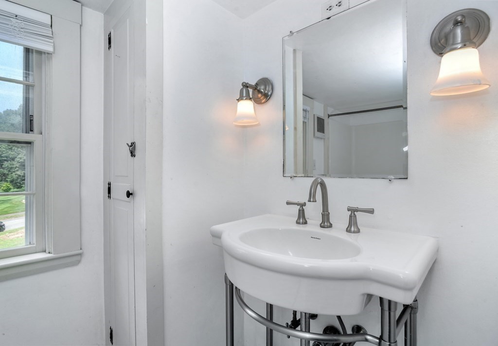 208 Prospect Street Hingham, MA 02043 - Photo 17 of 34 a bathroom with a sink and a mirror