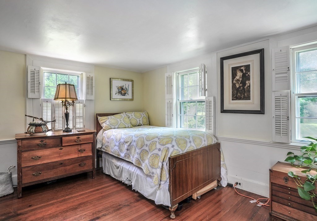 208 Prospect Street Hingham, MA 02043 - Photo 21 of 34 a bedroom with a bed wooden floor and window