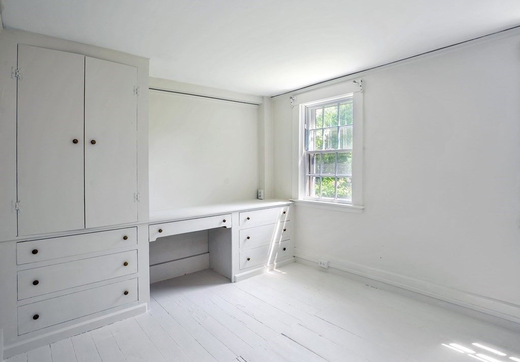 208 Prospect Street Hingham, MA 02043 - Photo 22 of 34 a room with a window and a dresser