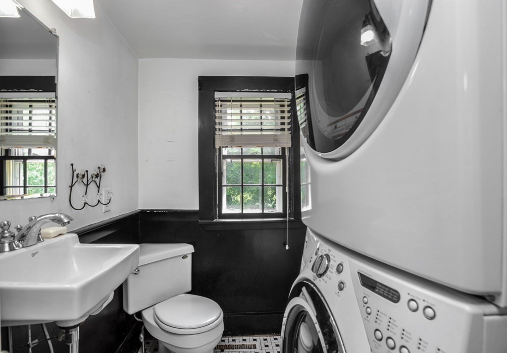 208 Prospect Street Hingham, MA 02043 - Photo 25 of 34 a bathroom with a sink a toilet and a mirror