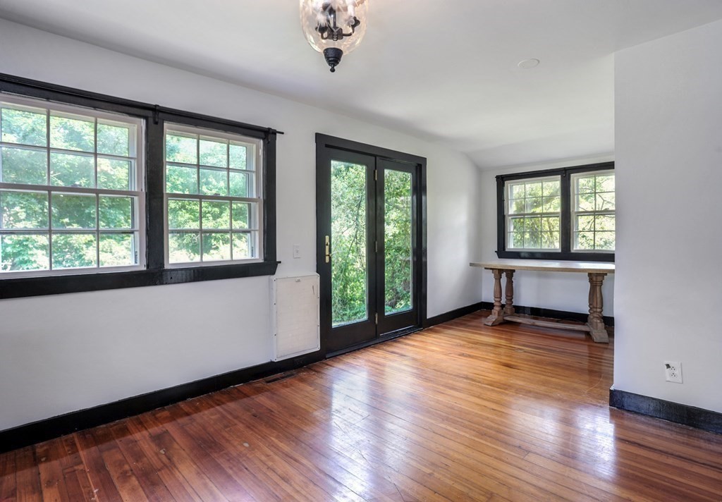 208 Prospect Street Hingham, MA 02043 - Photo 29 of 34 a view of an empty room with wooden floor and a window