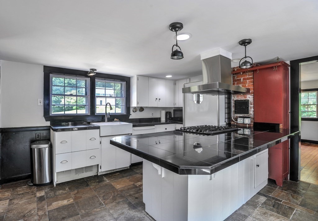208 Prospect Street Hingham, MA 02043 - Photo 30 of 34 a kitchen with stainless steel appliances granite countertop a sink a stove and a wooden floors