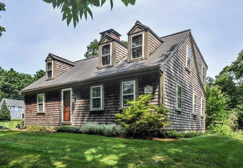 208 Prospect Street Hingham, MA 02043 - Photo 3 of 34 a front view of a house with a garden