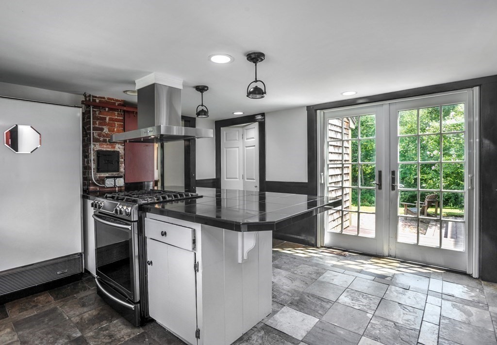 208 Prospect Street Hingham, MA 02043 - Photo 33 of 34 a kitchen with stainless steel appliances granite countertop a stove and a large window