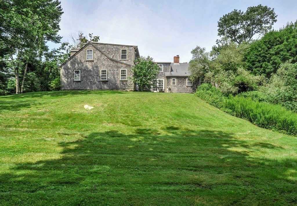 208 Prospect Street Hingham, MA 02043 - Photo 5 of 34 a view of a big house with a big yard and large trees