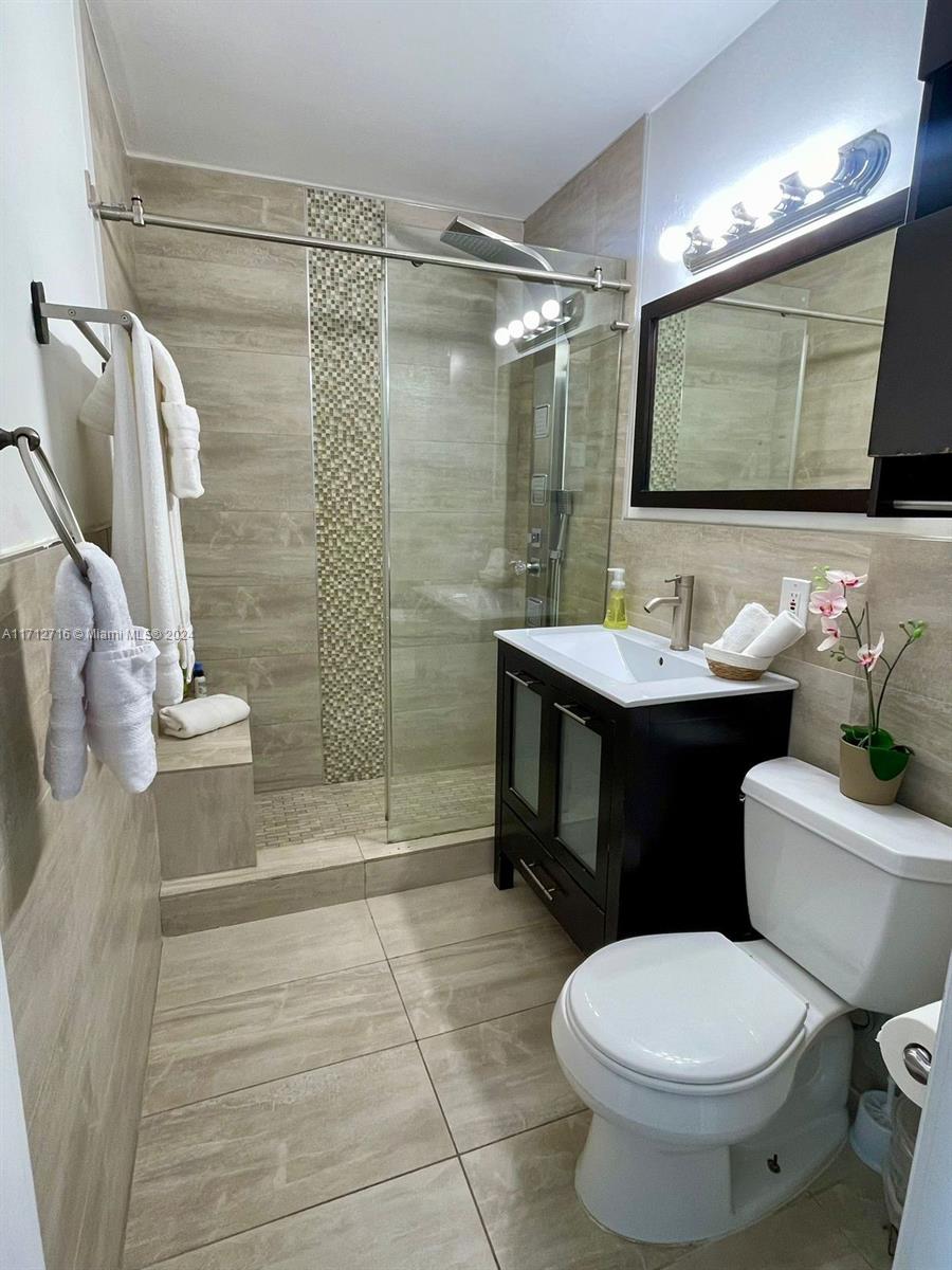 5445 Collins Avenue, Unit TS7 Miami Beach, FL 33140 - Photo 16 of 24 a bathroom with a sink toilet and shower