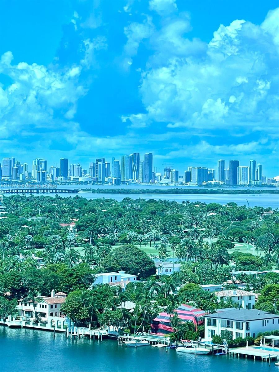 5445 Collins Avenue, Unit TS7 Miami Beach, FL 33140 - Photo 17 of 24 a view of a house with a yard and potted plants