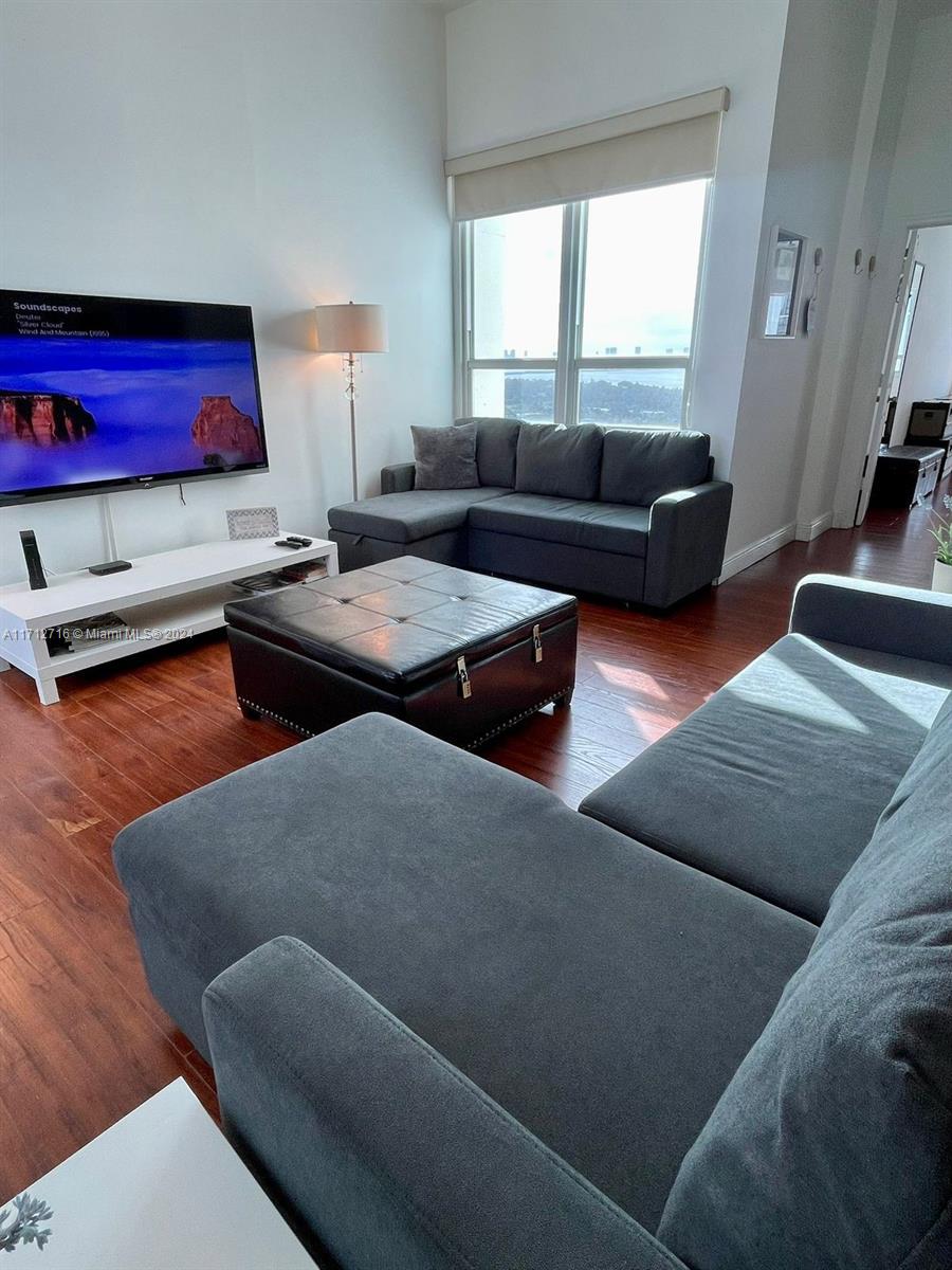 5445 Collins Avenue, Unit TS7 Miami Beach, FL 33140 - Photo 2 of 24 a living room with furniture and a window