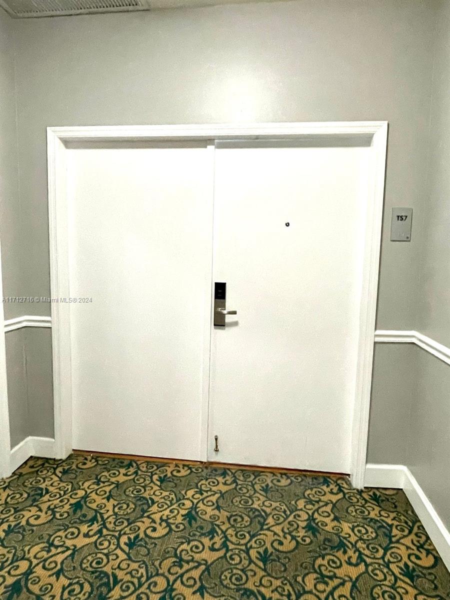 5445 Collins Avenue, Unit TS7 Miami Beach, FL 33140 - Photo 22 of 24 a view of wooden floor