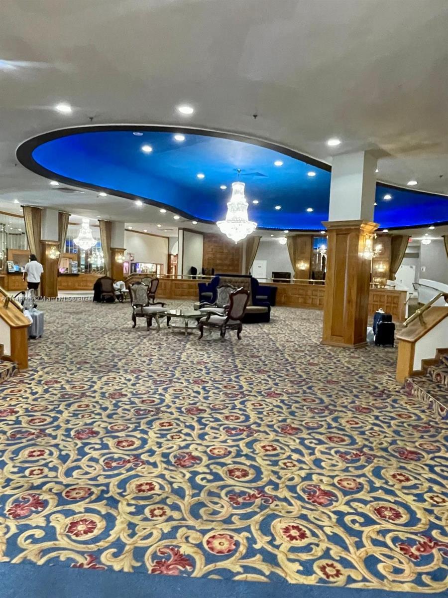 5445 Collins Avenue, Unit TS7 Miami Beach, FL 33140 - Photo 24 of 24 a view of a lobby with a couch and chairs