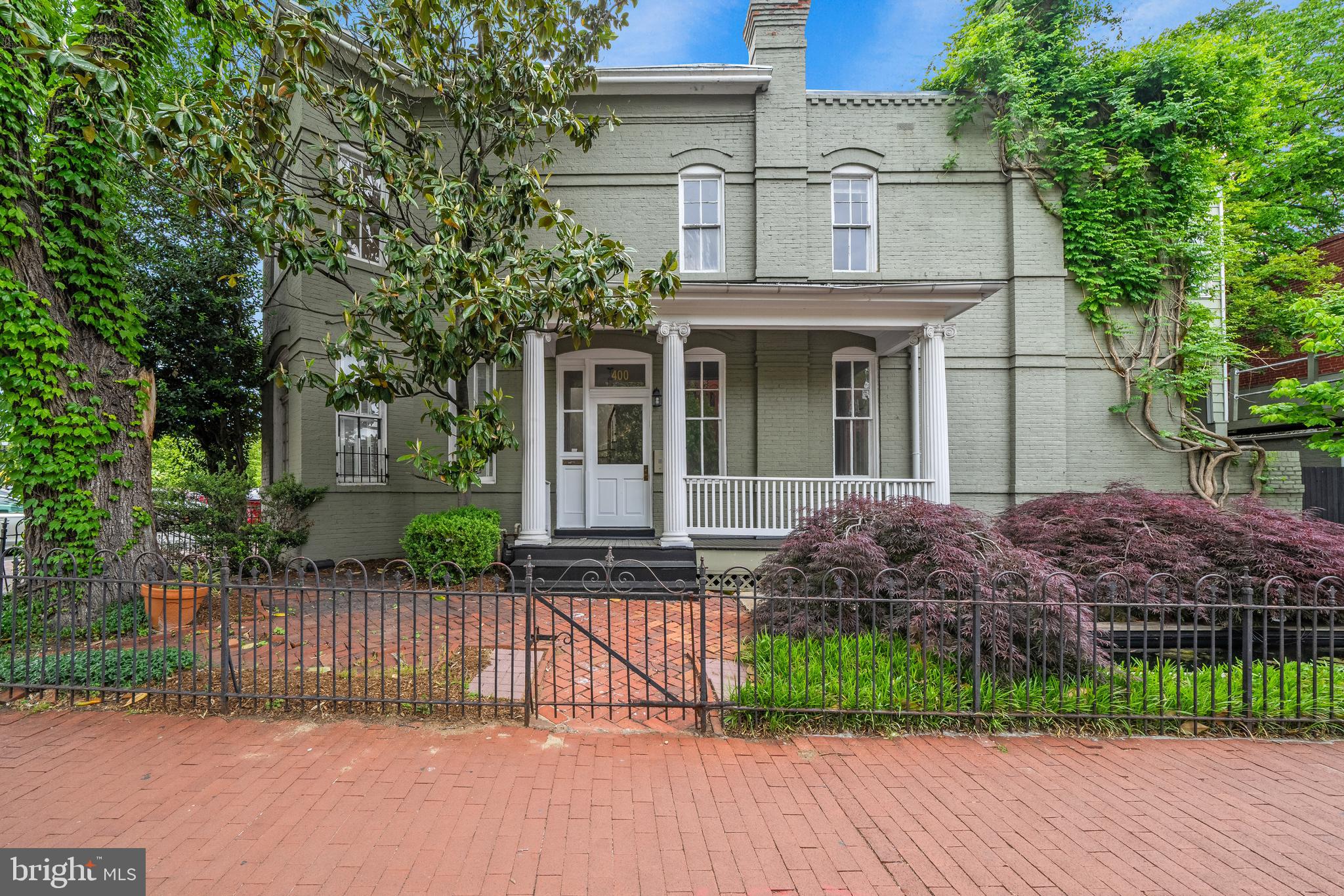 400 7th Street Southeast Washington, DC 20003 - Photo 2 of 23 a front view of a house with a garden