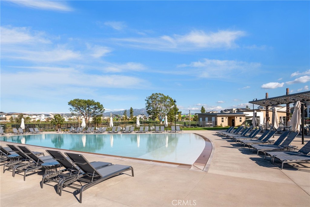 121 Baluster Irvine, CA 92618 - Photo 74 of 80 a view of a swimming pool with outdoor seating and city view