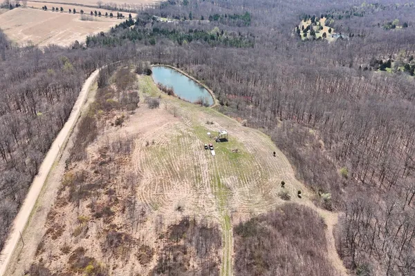 a view of a roof deck with furniture and garden