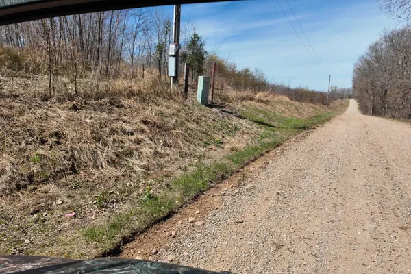 a view of a backyard of the house