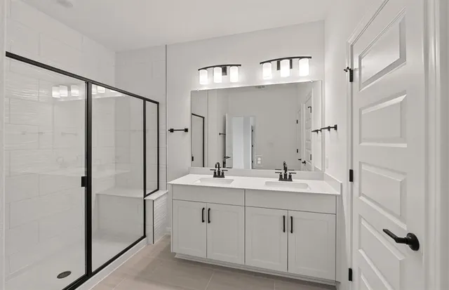a bathroom with a double vanity sink mirror and double