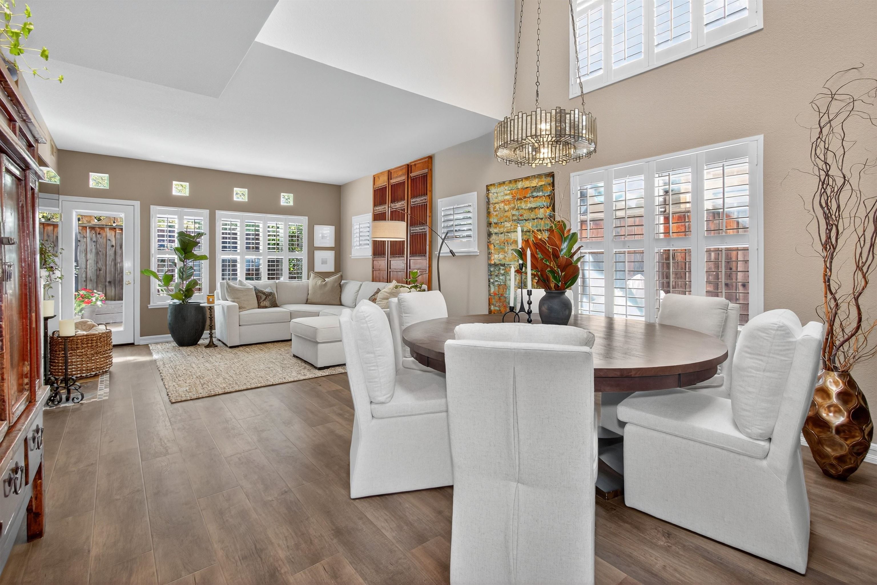 6206 Lakeview Circle San Ramon, CA 94582 - Photo 12 of 57 a living room with furniture dining table and a chandelier