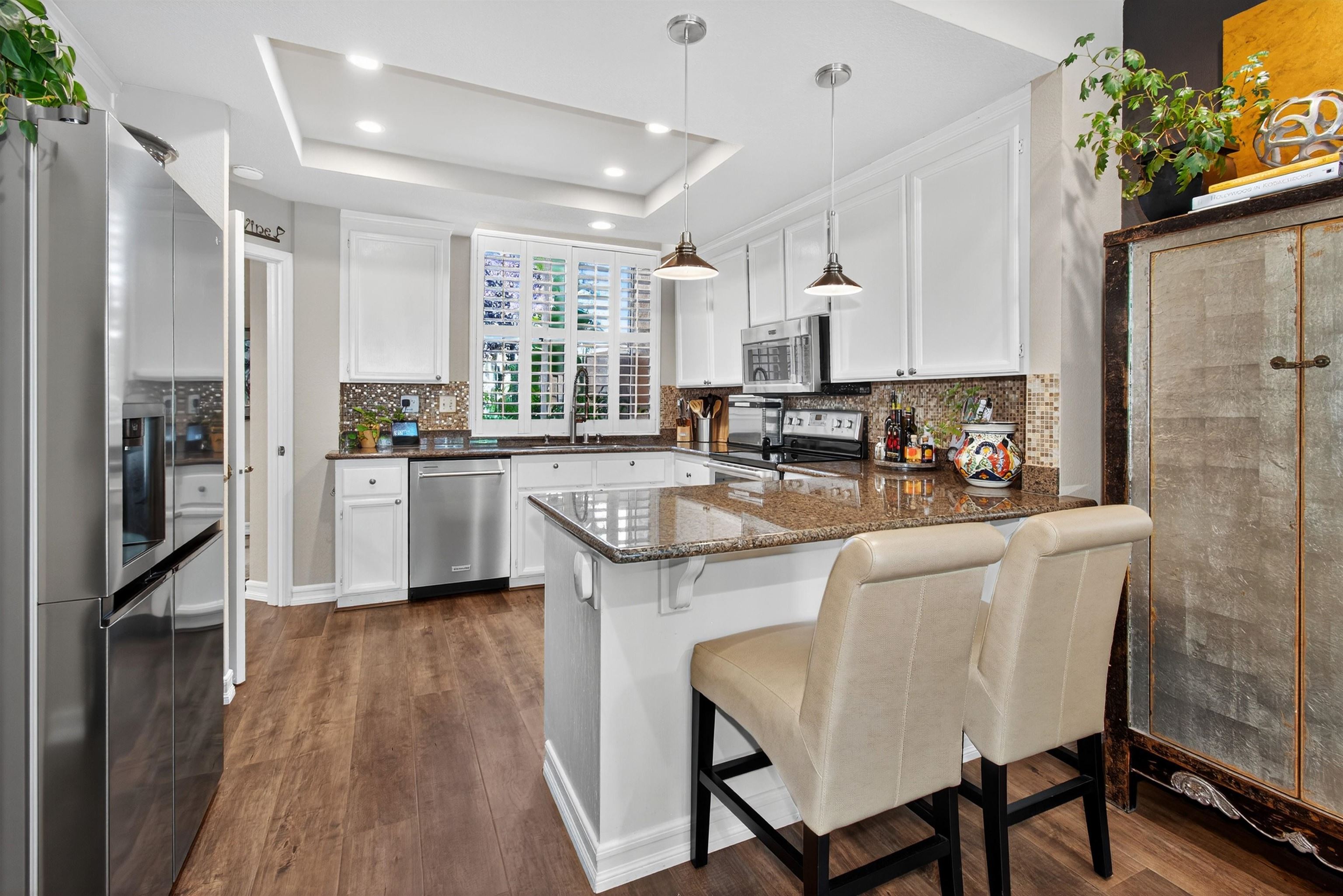6206 Lakeview Circle San Ramon, CA 94582 - Photo 20 of 57 a kitchen with stainless steel appliances granite countertop a stove a sink a refrigerator and a refrigerator