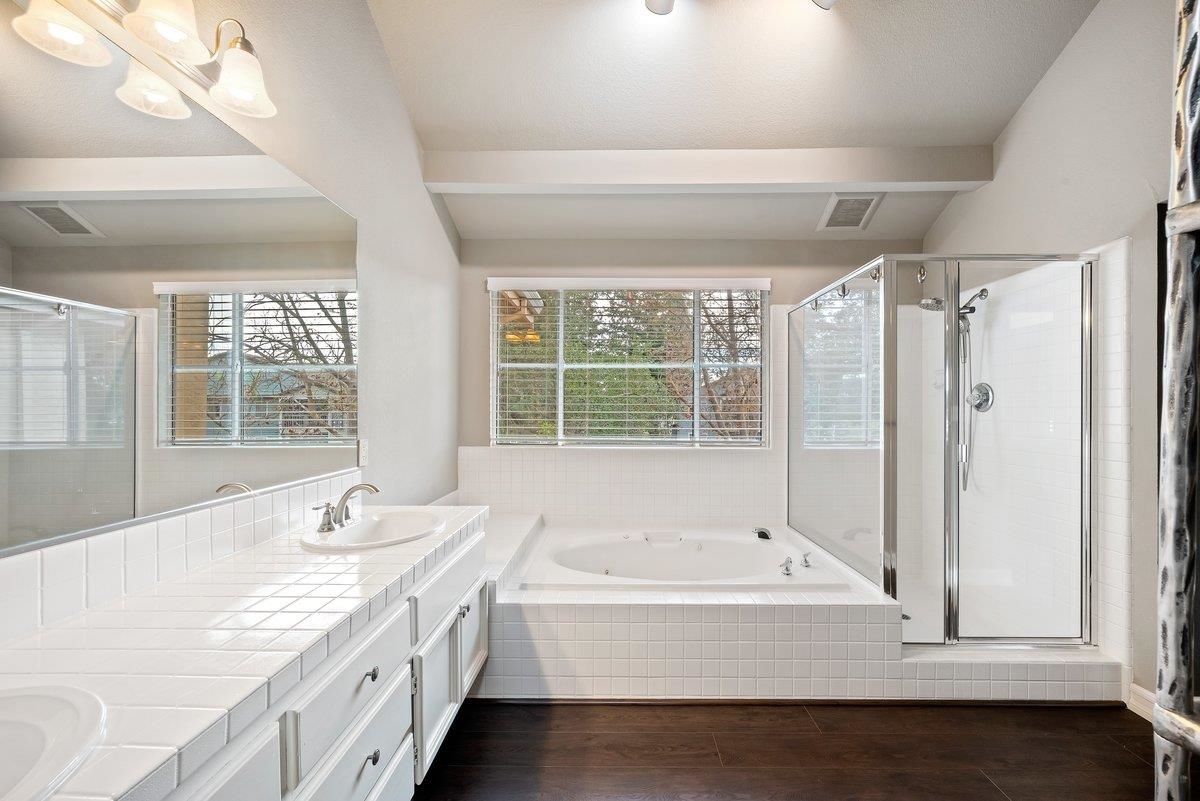 6206 Lakeview Circle San Ramon, CA 94582 - Photo 39 of 57 a bathroom with a granite countertop sink and a bathtub