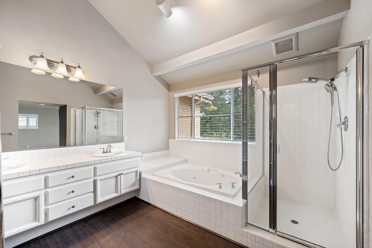 6206 Lakeview Circle San Ramon, CA 94582 - Photo 40 of 57 a bathroom with a tub sink shower and mirror