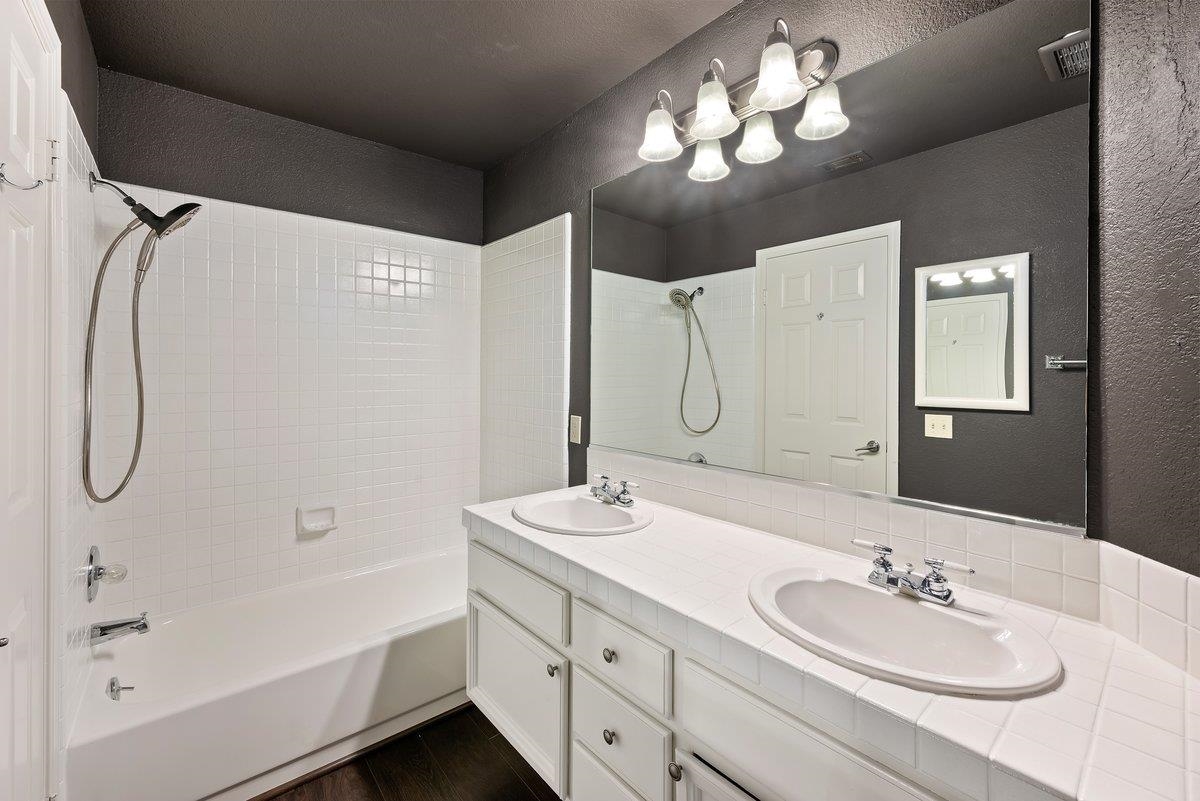 6206 Lakeview Circle San Ramon, CA 94582 - Photo 41 of 57 a bathroom with a double vanity sink mirror and shower