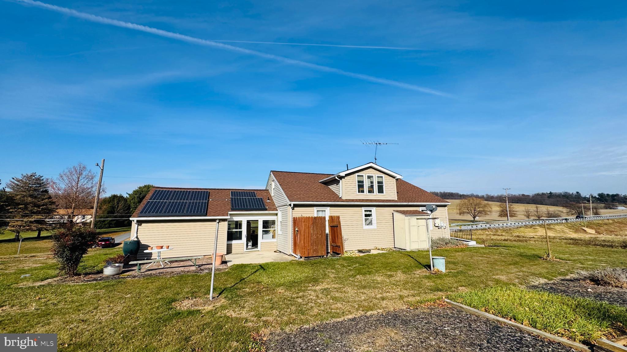 2311 Bachmans Valley Road Manchester, MD 21102 - Photo 5 of 6 a front view of a house with a yard