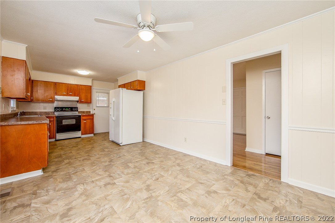 660 Pleasant Loop Fayetteville, NC 28311 - Photo 11 of 35 a view of kitchen with furniture and stainless steel appliances
