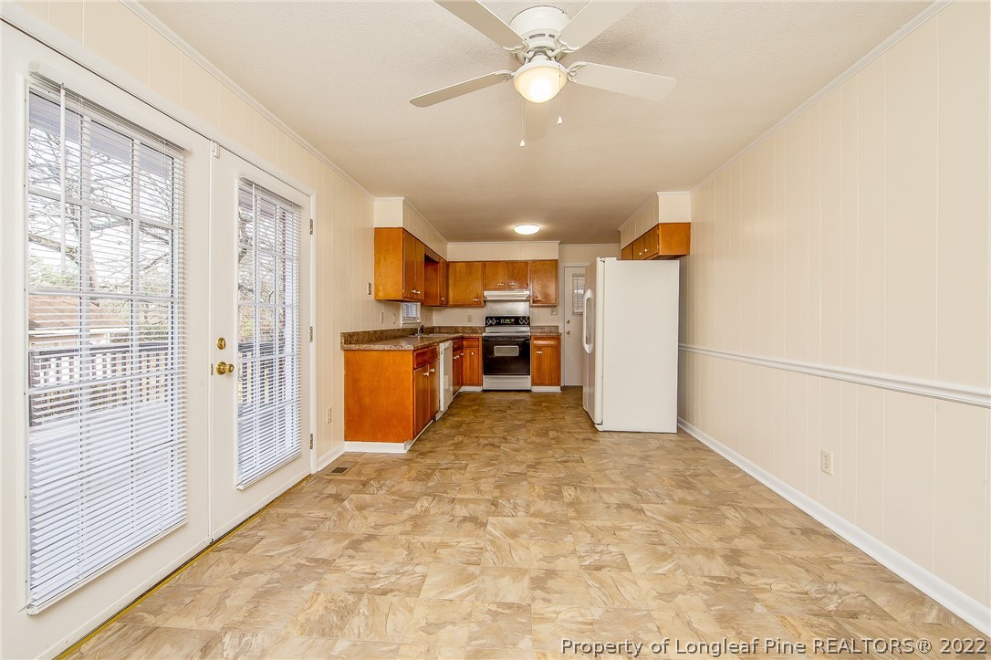 660 Pleasant Loop Fayetteville, NC 28311 - Photo 13 of 35 a view of a kitchen with a stove cabinets and a kitchen