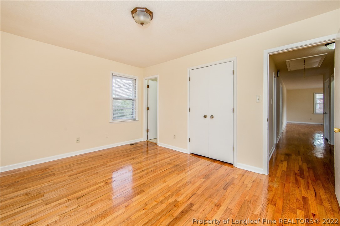 660 Pleasant Loop Fayetteville, NC 28311 - Photo 17 of 35 a view of an empty room with wooden floor