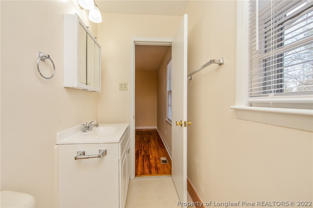 660 Pleasant Loop Fayetteville, NC 28311 - Photo 21 of 35 a bathroom with a sink toilet and vanity