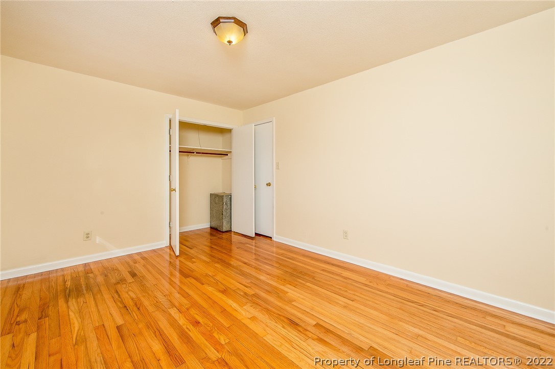 660 Pleasant Loop Fayetteville, NC 28311 - Photo 23 of 35 a view of empty room with wooden floor