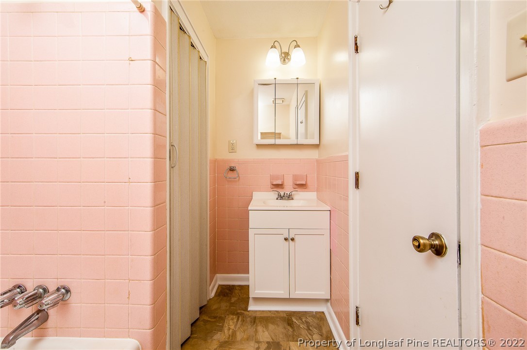 660 Pleasant Loop Fayetteville, NC 28311 - Photo 24 of 35 a bathroom with a sink and a mirror