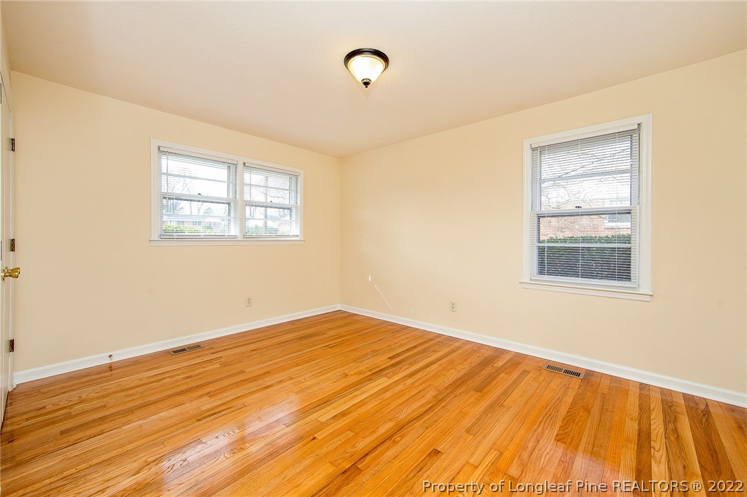 660 Pleasant Loop Fayetteville, NC 28311 - Photo 25 of 35 a view of empty room with wooden floor